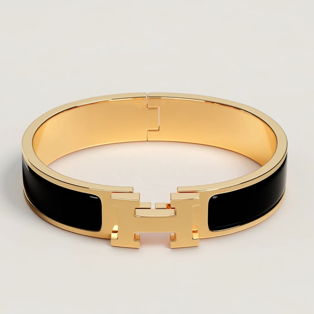 Hermes small black and gold Clic H bracelet